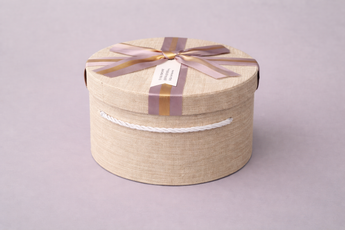 Coffret cadeau rond premium avec ruban